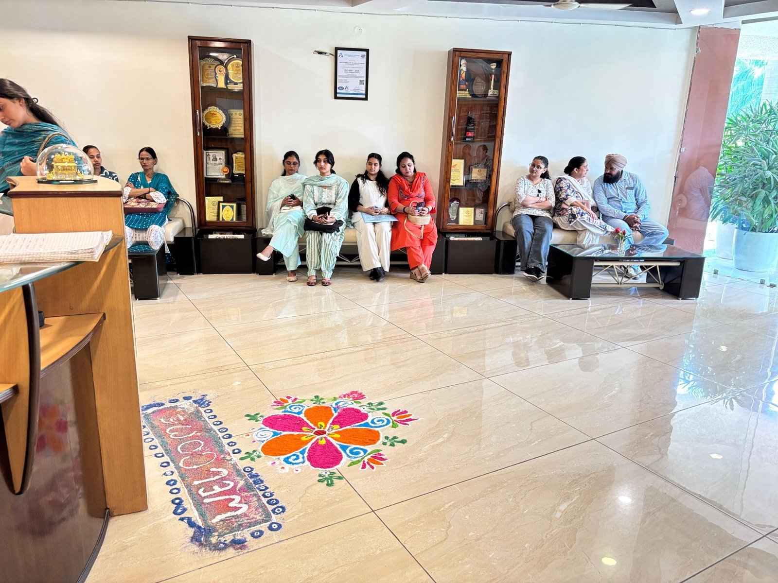Rangoli and reception desk on Orientation Day at MSK College